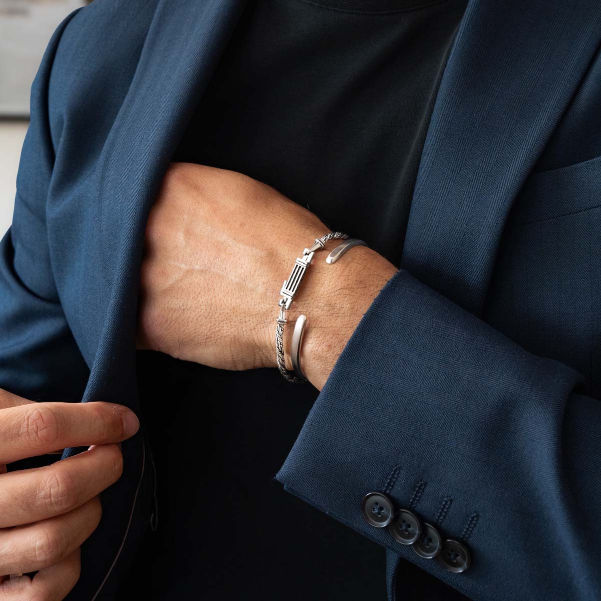 Model wearing Nadir sterling silver men’s bracelet and cuff bracelet for men from Ninetwofive