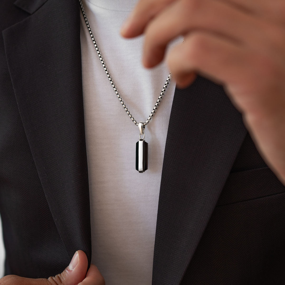 Model wearing sterling silver black onyx samir mens pendant from Ninetwofive