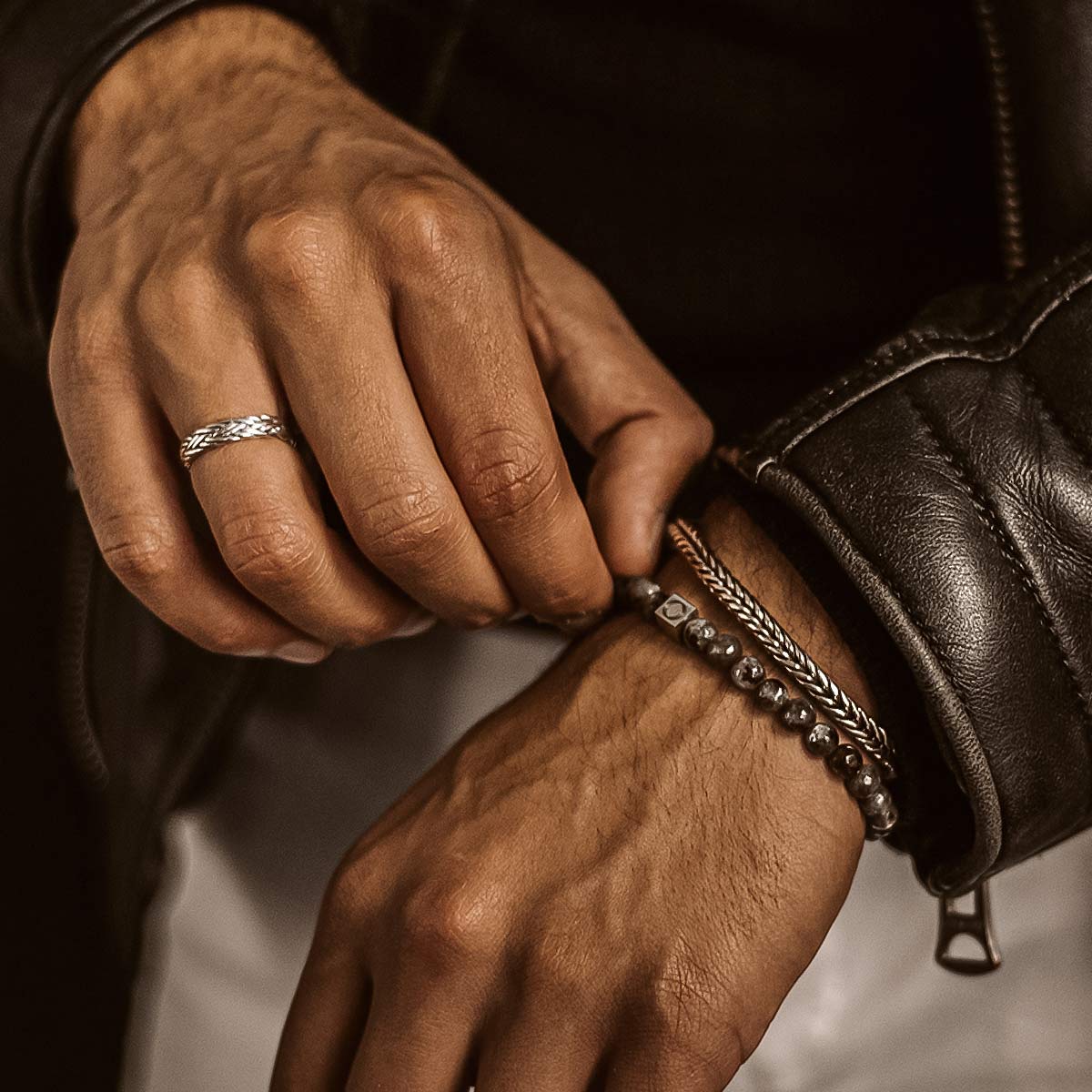 A man wearing a leather jacket.
