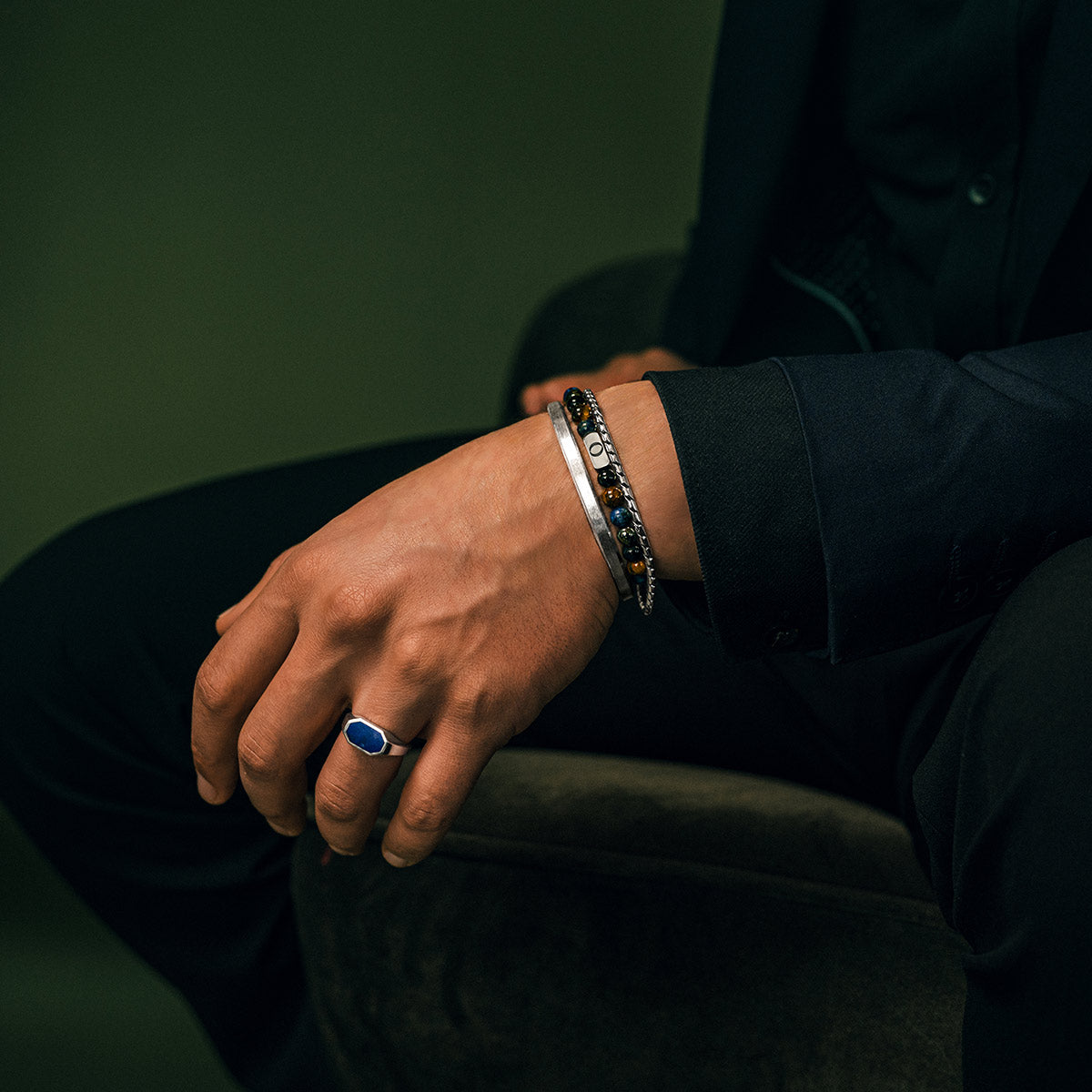 Man wearing the Limited Edition Father’s Day tiger eye bracelet with sterling silver details