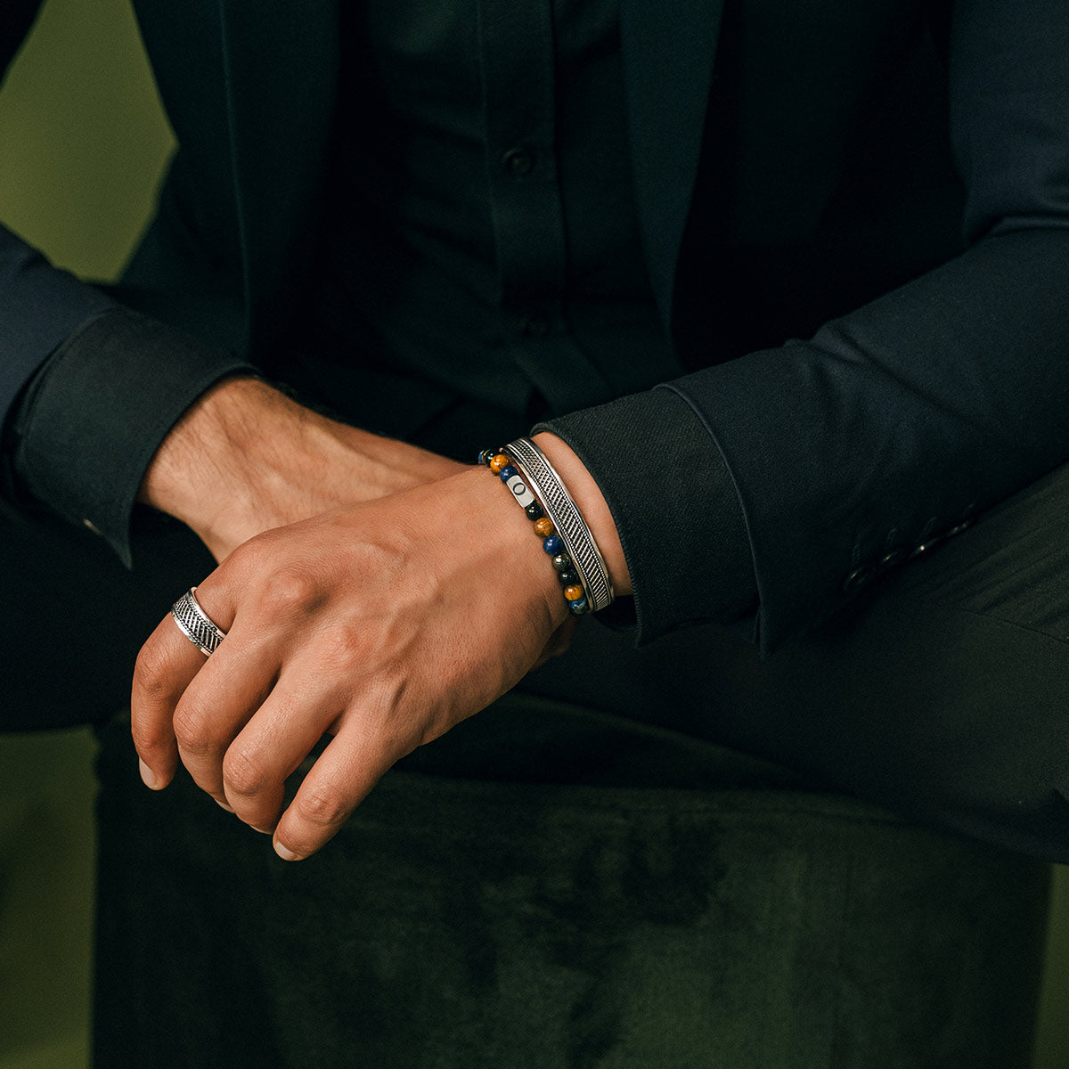 Close-up of a men’s tiger eye bracelet styled on wrist