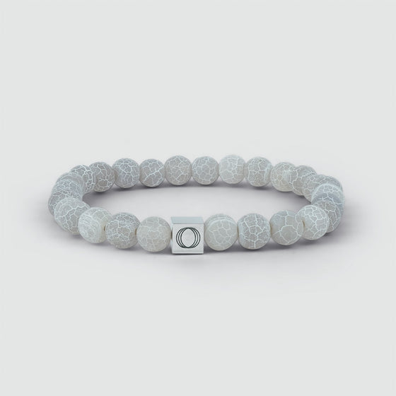 Detailed front shot of the Abyad mens bracelet, showcasing the weathering stone and the central Ninetwofive logo.