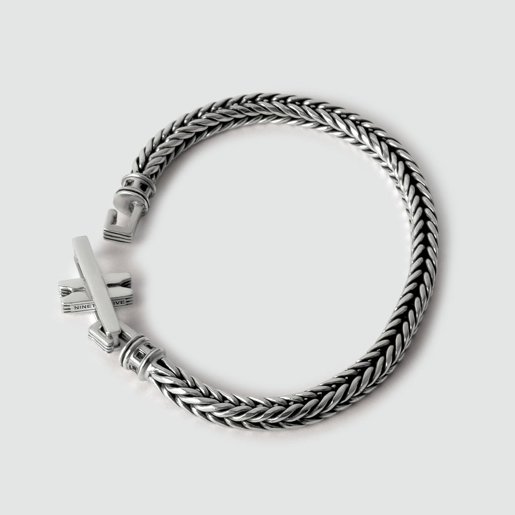 A "Adam - Sterling Silver Braided Bracelet 5mm" with a silver clasp, perfect for men.