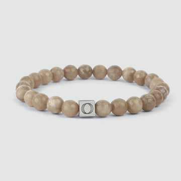 A Albij - Beige Beaded Bracelet 8mm with a silver charm made of jade stone.