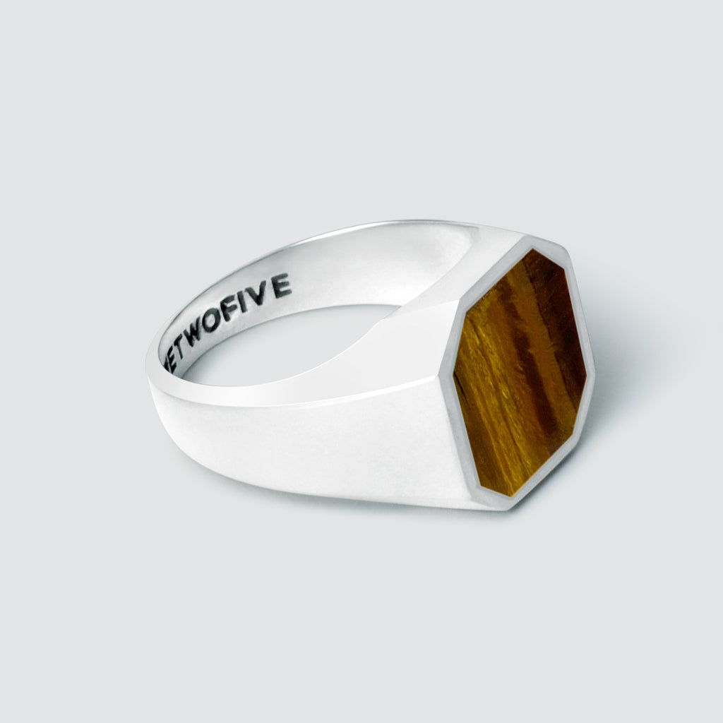 A signet ring with an Alem - Tiger Eye Stone Signet Ring 13mm inlay and engraved design.