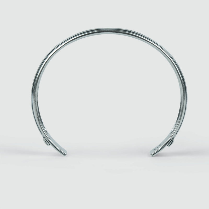 Arkan 925 sterling silver mens bracelet on a white surface, showcasing polished edges.