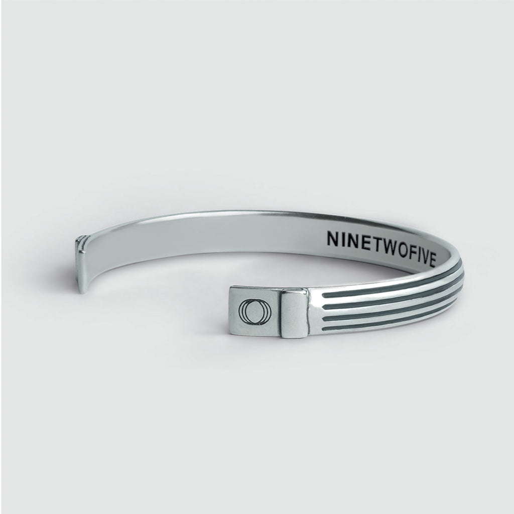 A 925 Silver Arkan and Mateen - set cuff bracelet with the word ninewire on it.