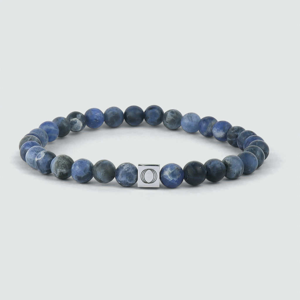 An Azraq - Blue Beaded Bracelet 6mm with the letter c on it.
