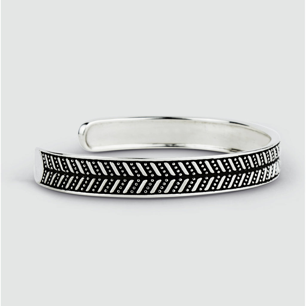 A Danyal - Oxidized Sterling Silver Bangle Bracelet 9mm with black and white designs, perfect for men's personalized style.