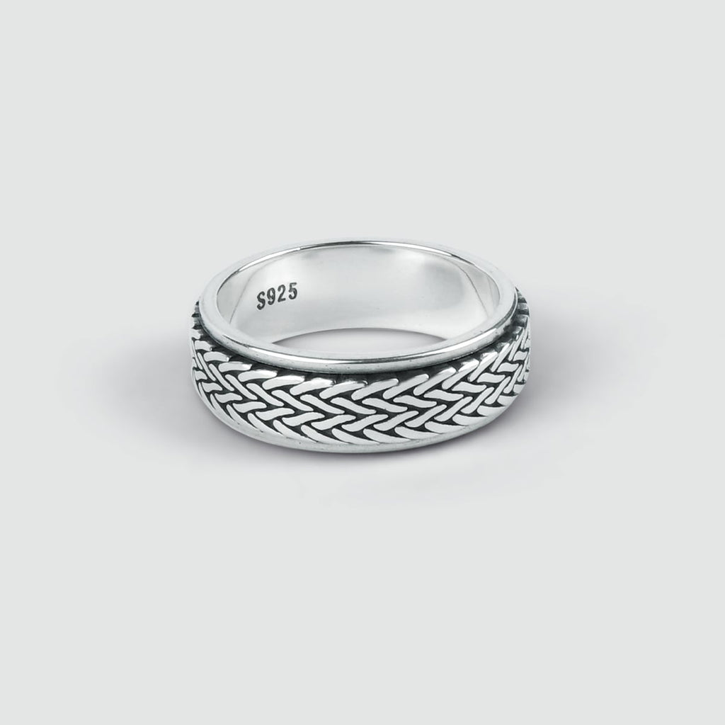 A Hani - Sterling Silver Spinner Ring 8mm with a braided design, perfect for him.