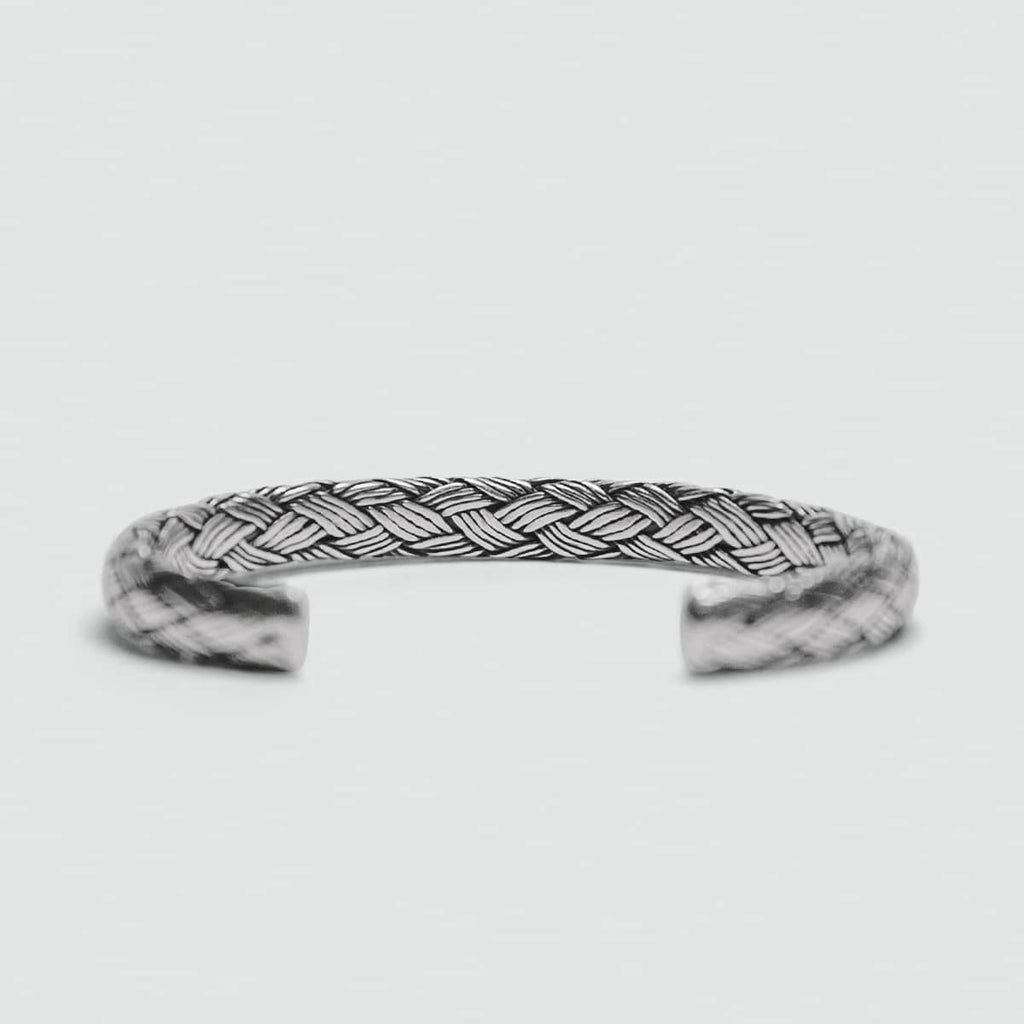 An Idris - Braided Silver Bangle Bracelet 8mm for men on a white background.