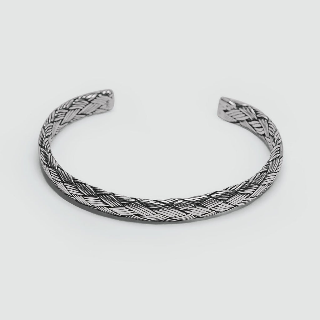 An Idris - Braided Silver Bangle Bracelet 8mm, perfect for men.