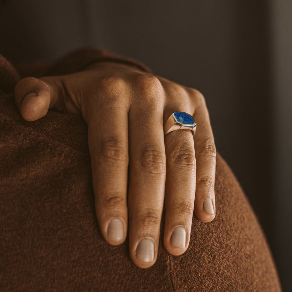 A woman wearing a Kadar - Blue Lapis Lazuli Stone Signet Ring 13mm.