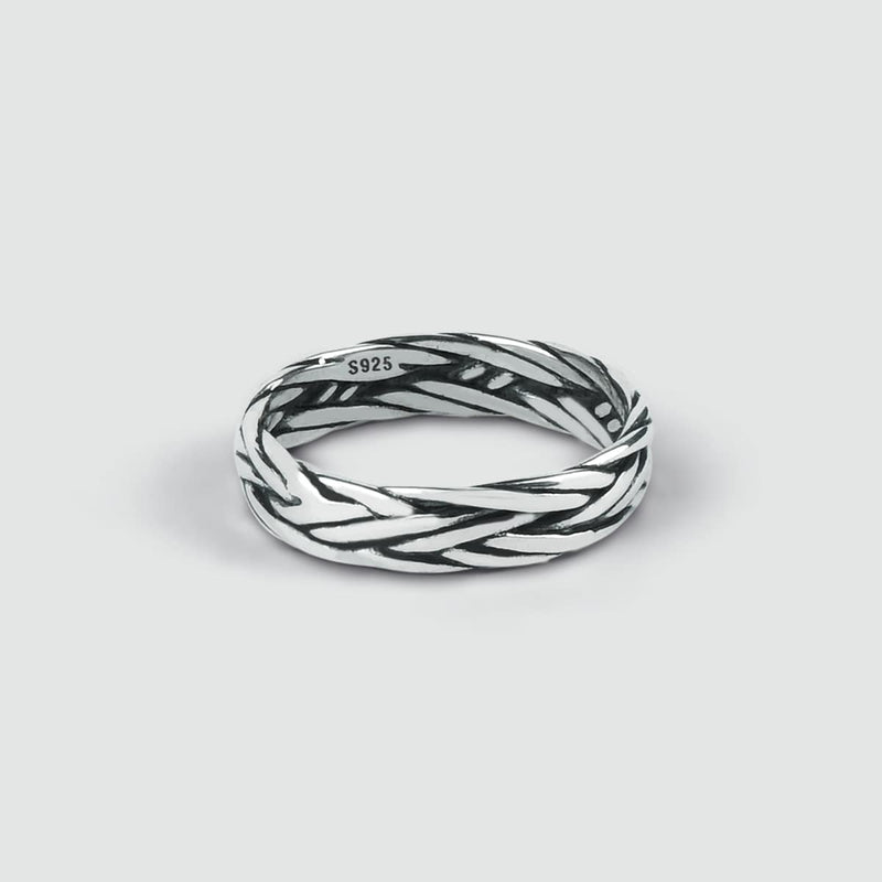 Close-up of the engraved Latif 5mm thin sterling silver mens ring, showcasing the braided design detail.