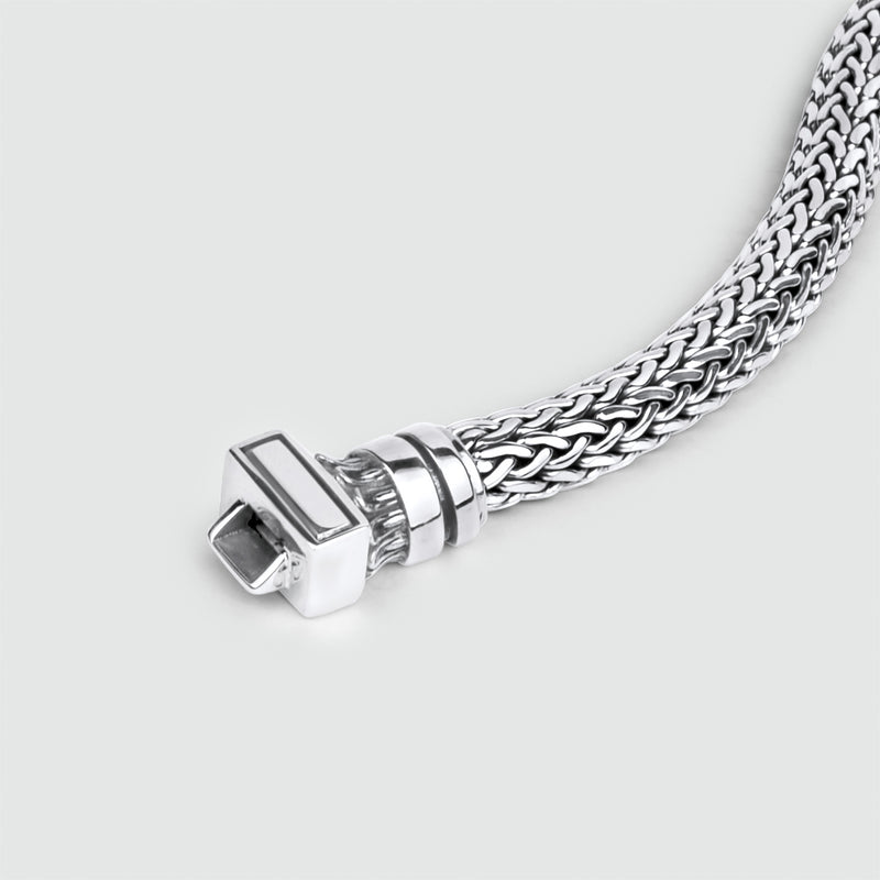 A stylish Ninetwofive Mirza sterling silver braided bracelet on a white background.