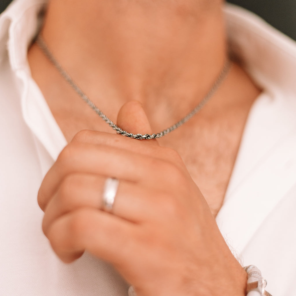A man wearing a Munir - Sterling Silver Rope Chain Necklace 3mm.
