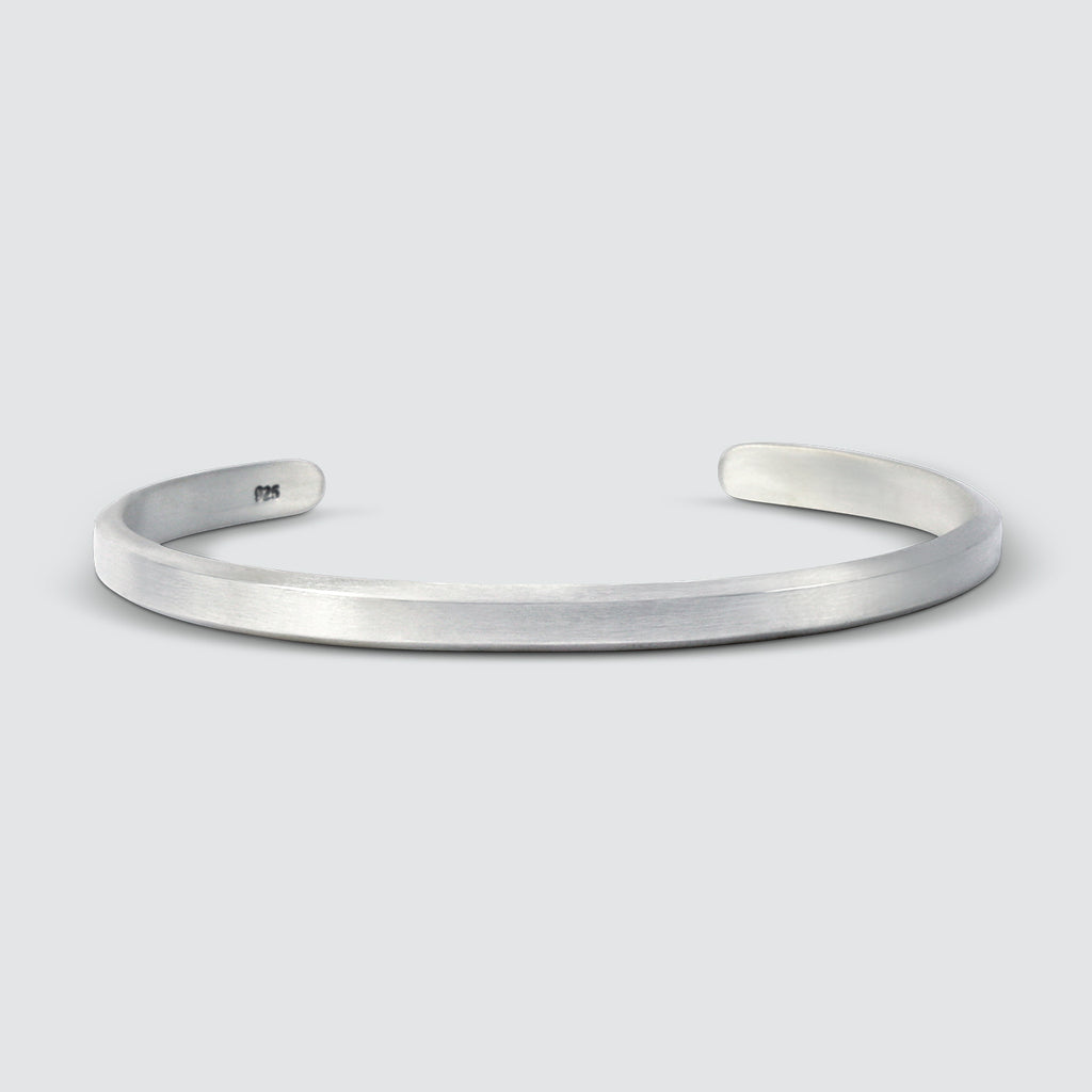 A Boulos and Noor - set cuff bracelet, handmade, on a white background.