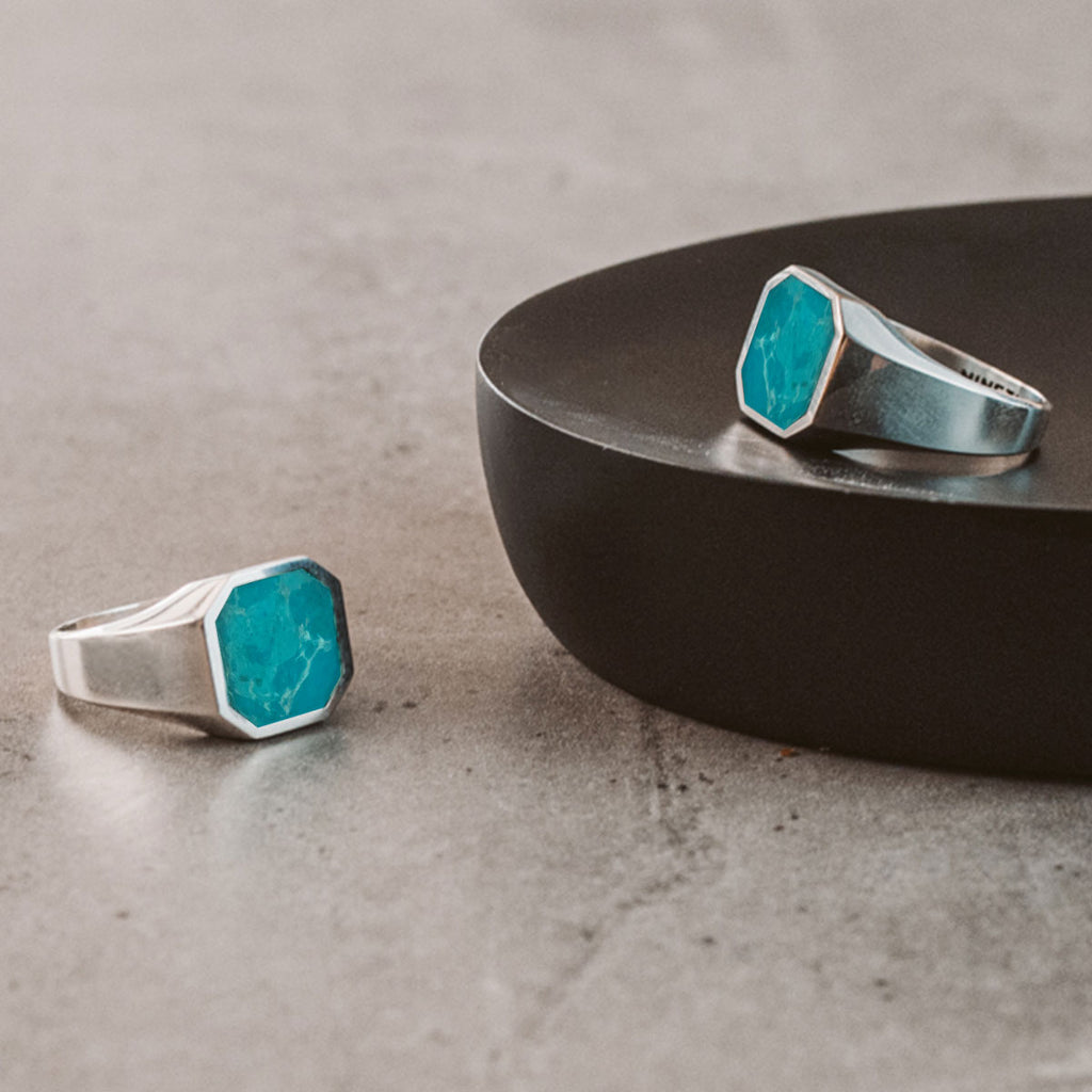 A sleek mens Nuri - Sterling Silver Blue Turquoise Signet Ring 13mm adorned with a vibrant turquoise stone.