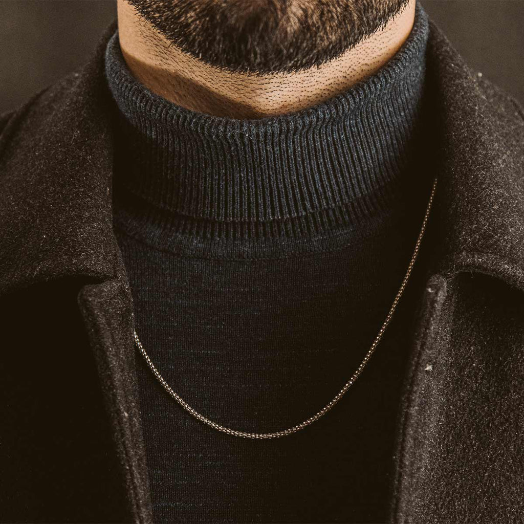 A close up of a bearded man wearing a Naseeb - Elegant Sterling Silver Chain Necklace 2.5mm.