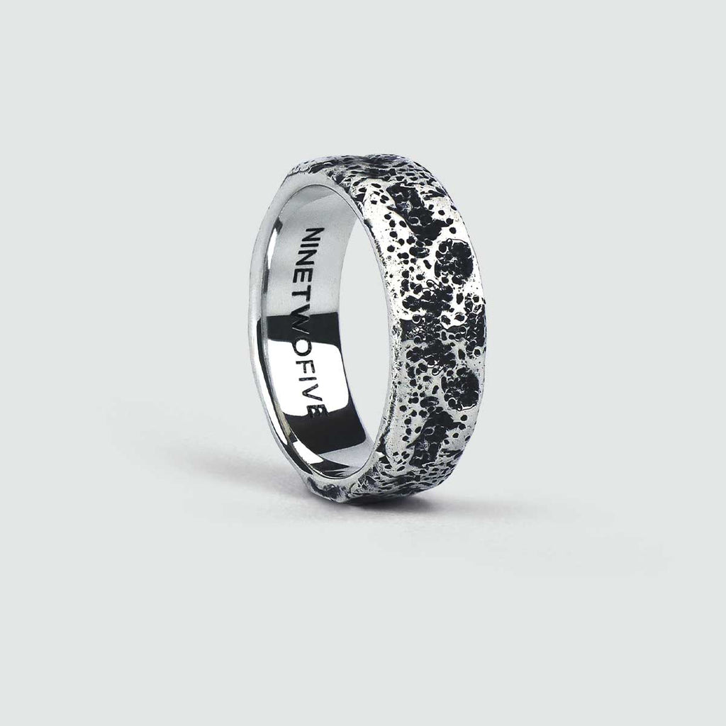 An engraved Tarif - Unique Sterling Silver Ring 7mm with black diamonds on it.