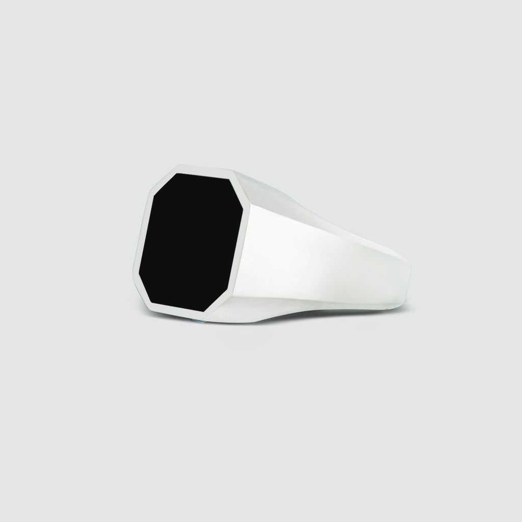 A Naim - Black Onyx Signet Ring 13mm engraved signet ring on a white background.