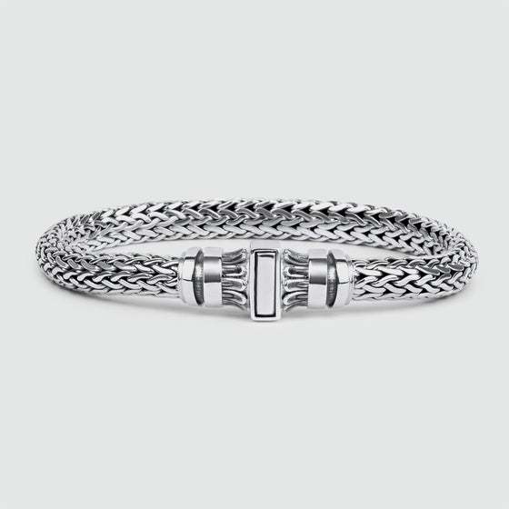 A Mirza sterling silver braided bracelet with a Ninetwofive clasp, perfect for men looking for a stylish and personalized accessory.