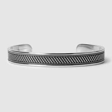 A Kaliq - Oxidized Sterling Silver Bangle 10mm with a black and white pattern.