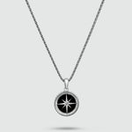 A black and white Safar - Sterling Silver Onyx Compass Pendant on a mens silver chain.