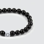 A sleek Aswad - Matt Black Beaded Bracelet 6mm with a silver clasp.