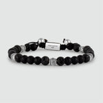 A Kaliq - Adjustable Onyx Black Beaded Bracelet in Silver 6mm with a silver bead.