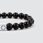 A sleek Aswad - Matt Black Beaded Bracelet 8mm with a silver clasp.