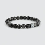 Aswad - Black Beaded Bracelet 8mm: A black beaded bracelet with the letter o on it, featuring a spectrolite stone.